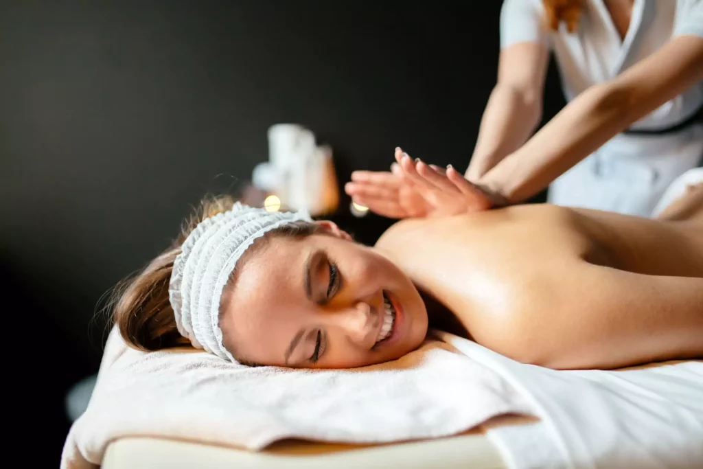 Girl smiling and getting massage