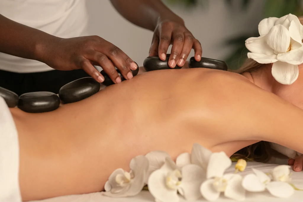 Girl taking stone massage at marhaba spa